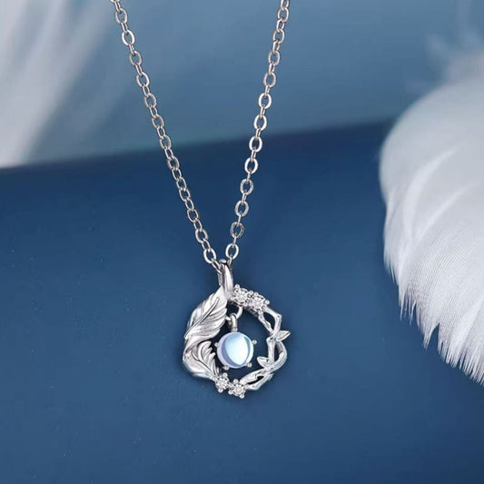 Sterling silver pendant necklace with opal center stone and feather detail