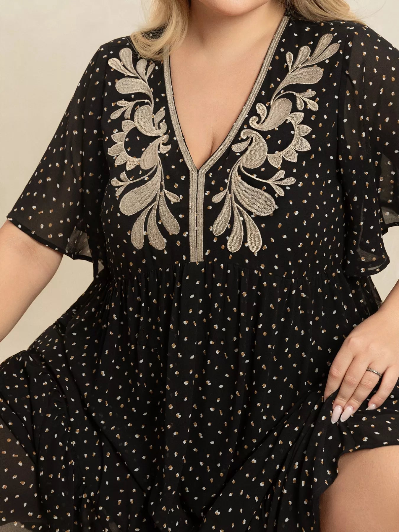 Plus size black embroidered maxi dress with polka dots and flowy short sleeves – boho chic evening or casual wear.