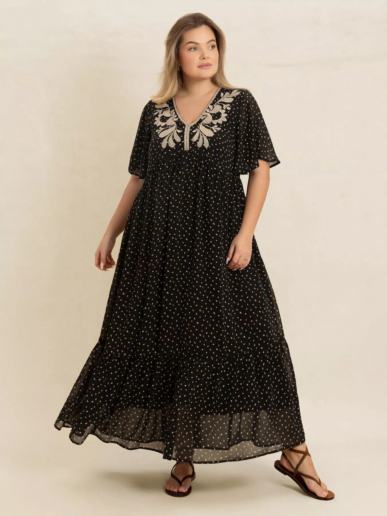 Plus size black embroidered maxi dress with polka dots and flowy short sleeves – boho chic evening or casual wear.