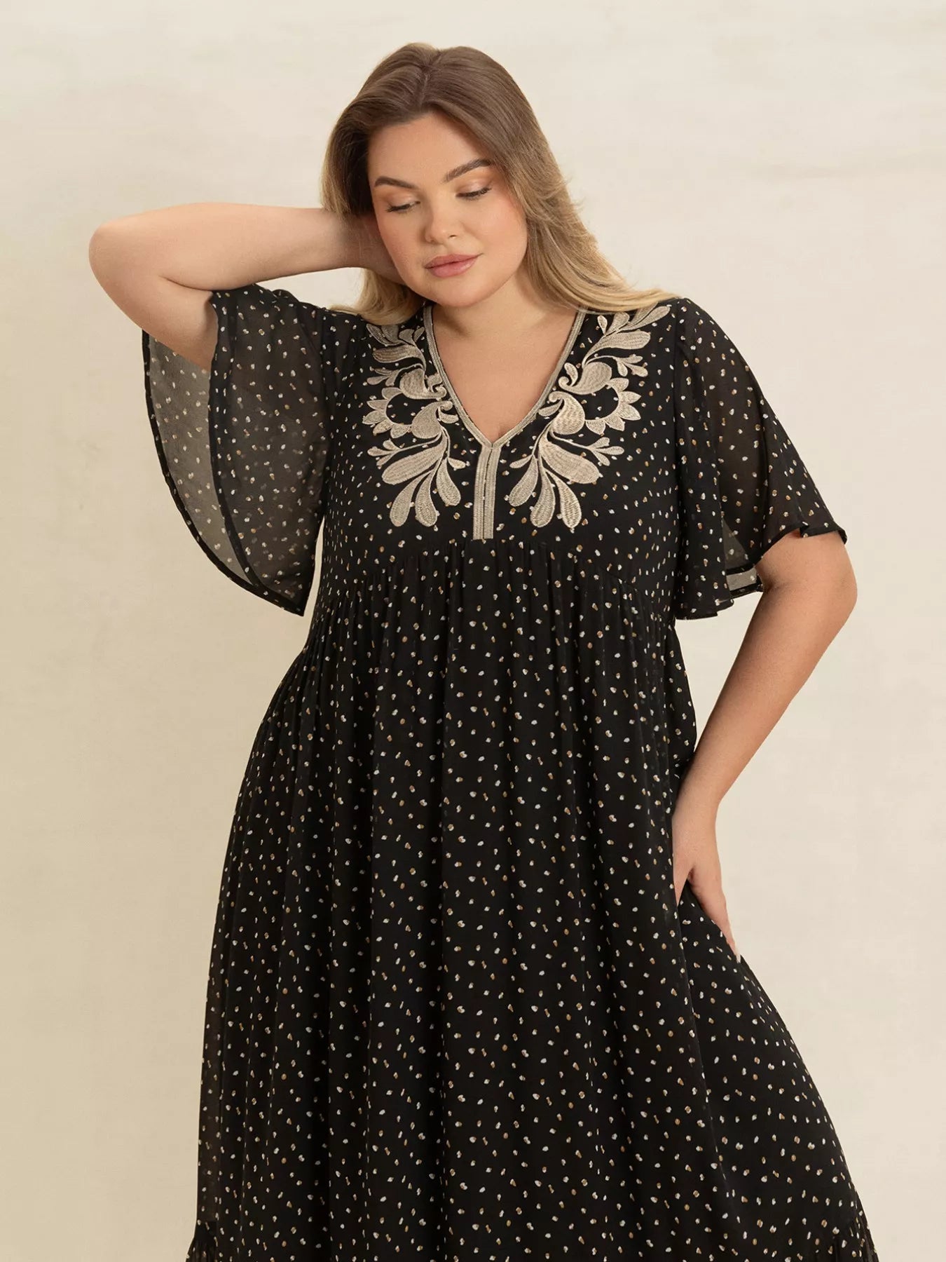 Plus size black embroidered maxi dress with polka dots and flowy short sleeves – boho chic evening or casual wear.
