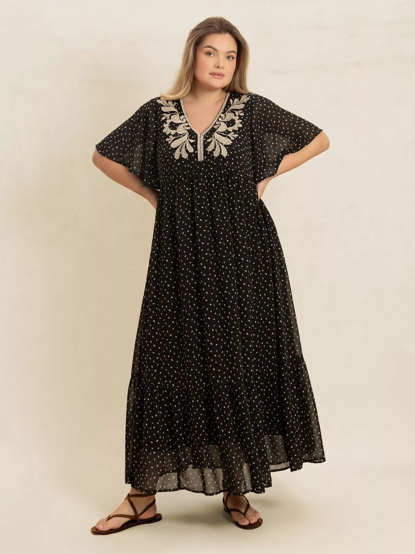 Plus size black embroidered maxi dress with polka dots and flowy short sleeves – boho chic evening or casual wear.