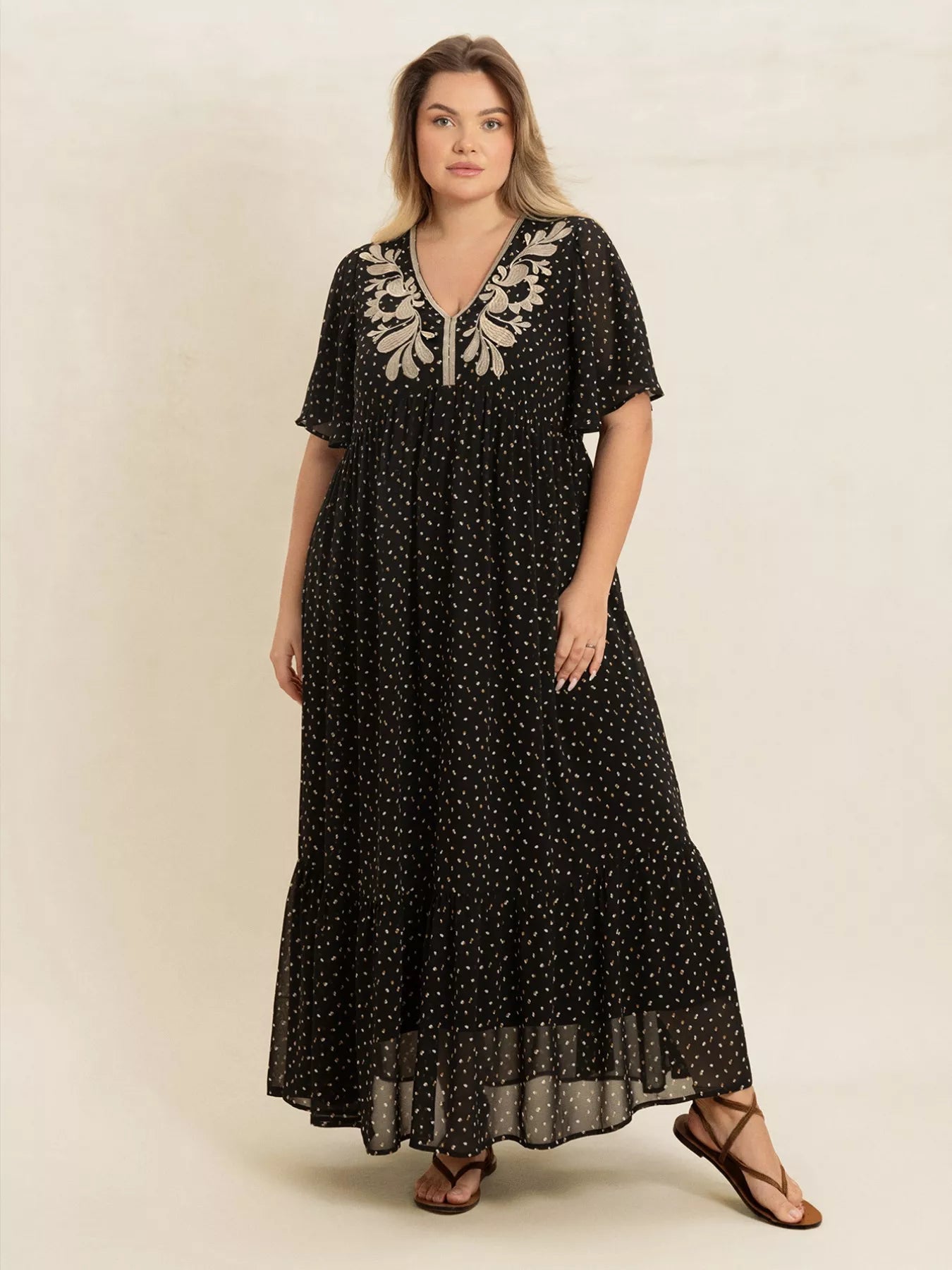 Plus size black embroidered maxi dress with polka dots and flowy short sleeves – boho chic evening or casual wear.