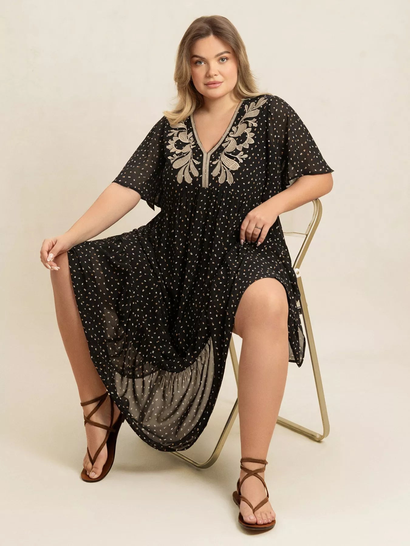 Plus size black embroidered maxi dress with polka dots and flowy short sleeves – boho chic evening or casual wear.