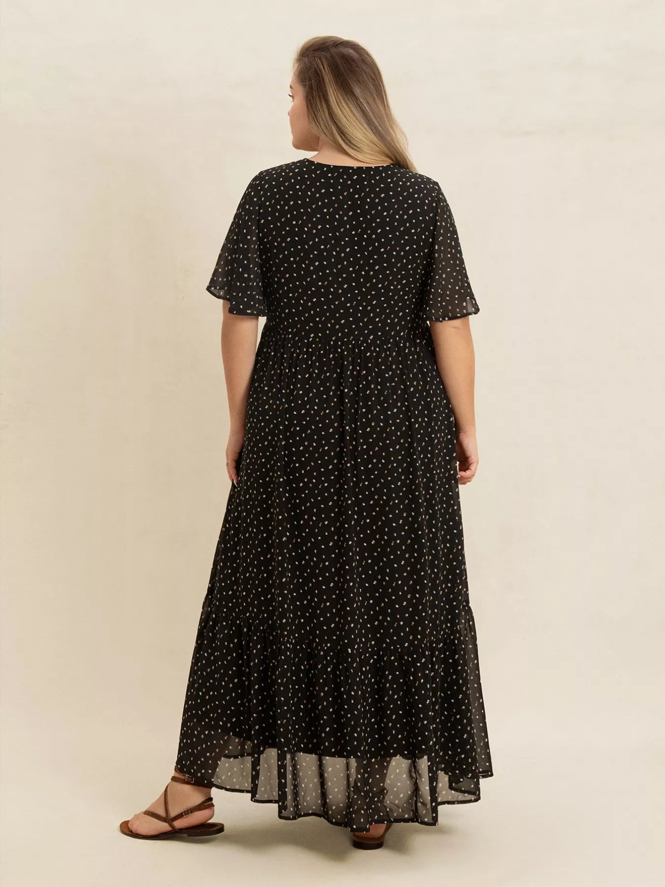 Plus size black embroidered maxi dress with polka dots and flowy short sleeves – boho chic evening or casual wear.