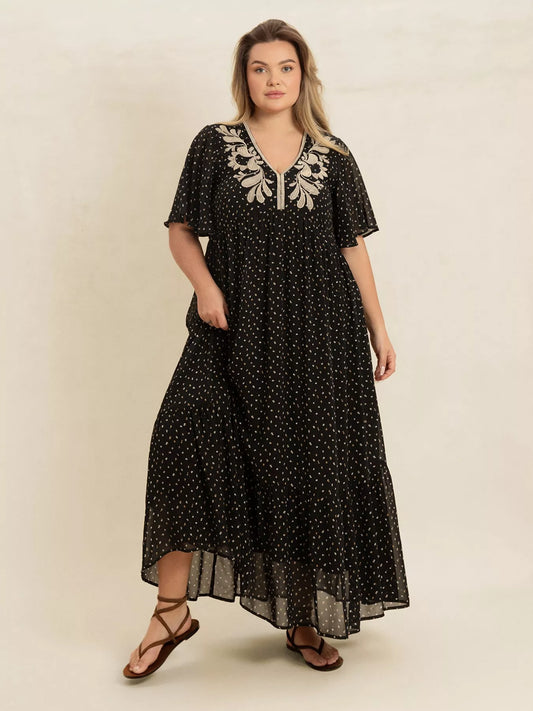 Plus size black embroidered maxi dress with polka dots and flowy short sleeves – boho chic evening or casual wear.