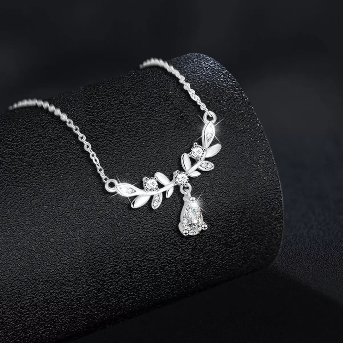 Sterling silver leaf necklace with teardrop moissanite pendant