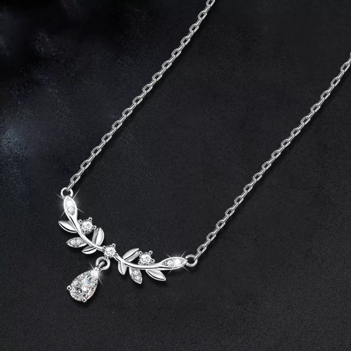 Sterling silver leaf necklace with teardrop moissanite pendant