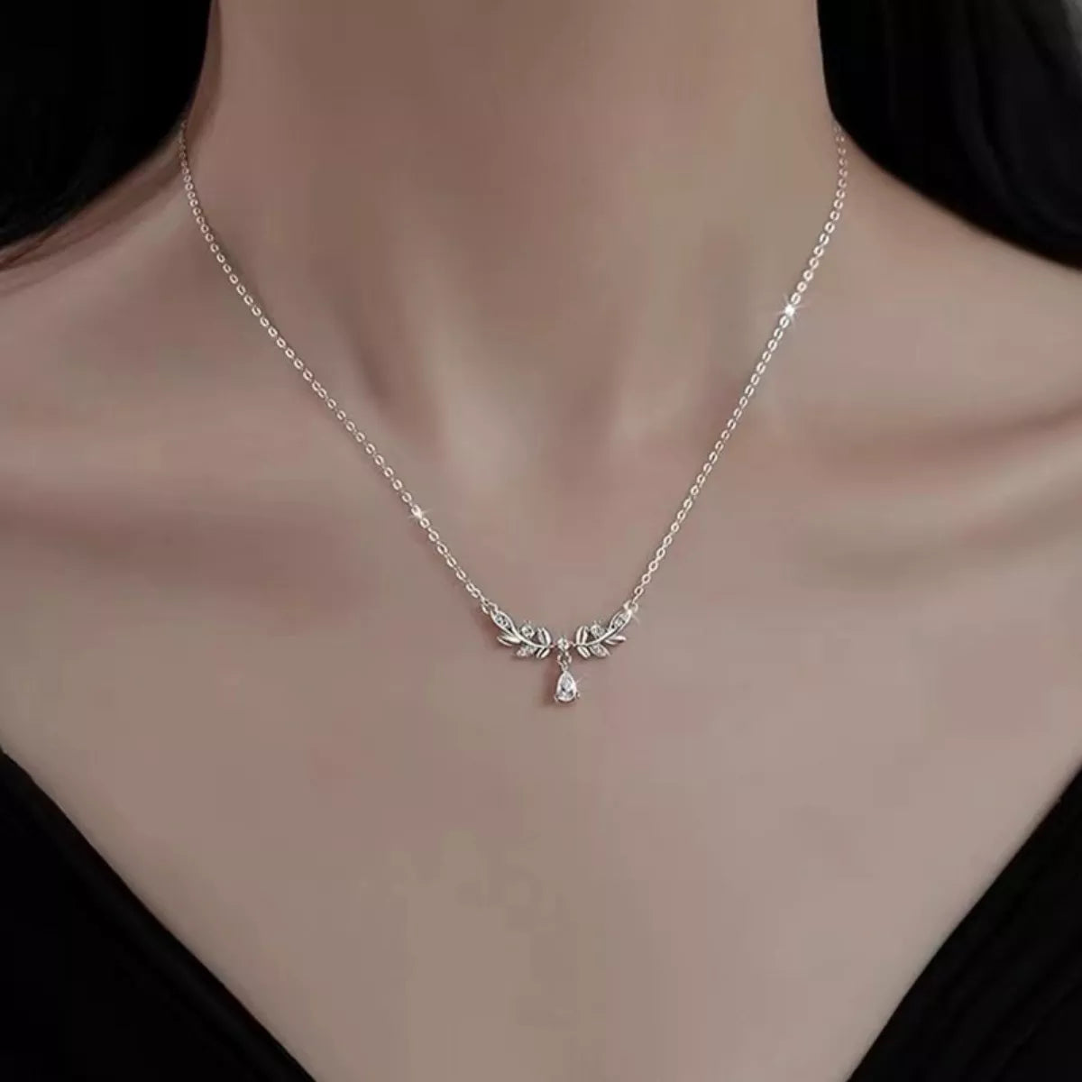 Sterling silver leaf necklace with teardrop moissanite pendant