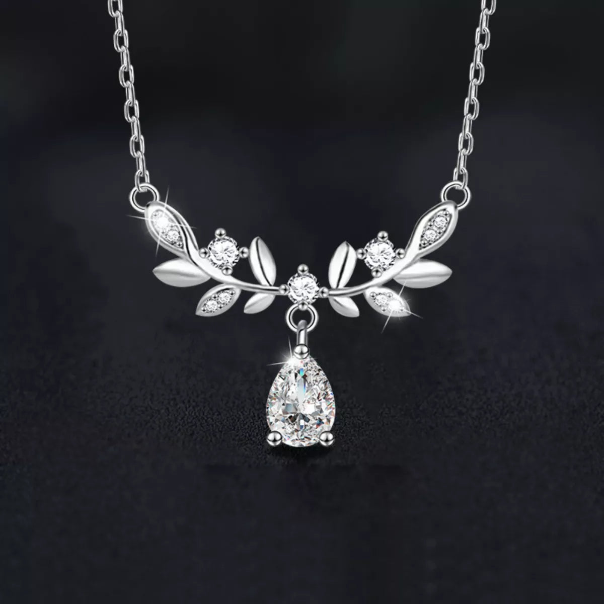 Sterling silver leaf necklace with teardrop moissanite pendant