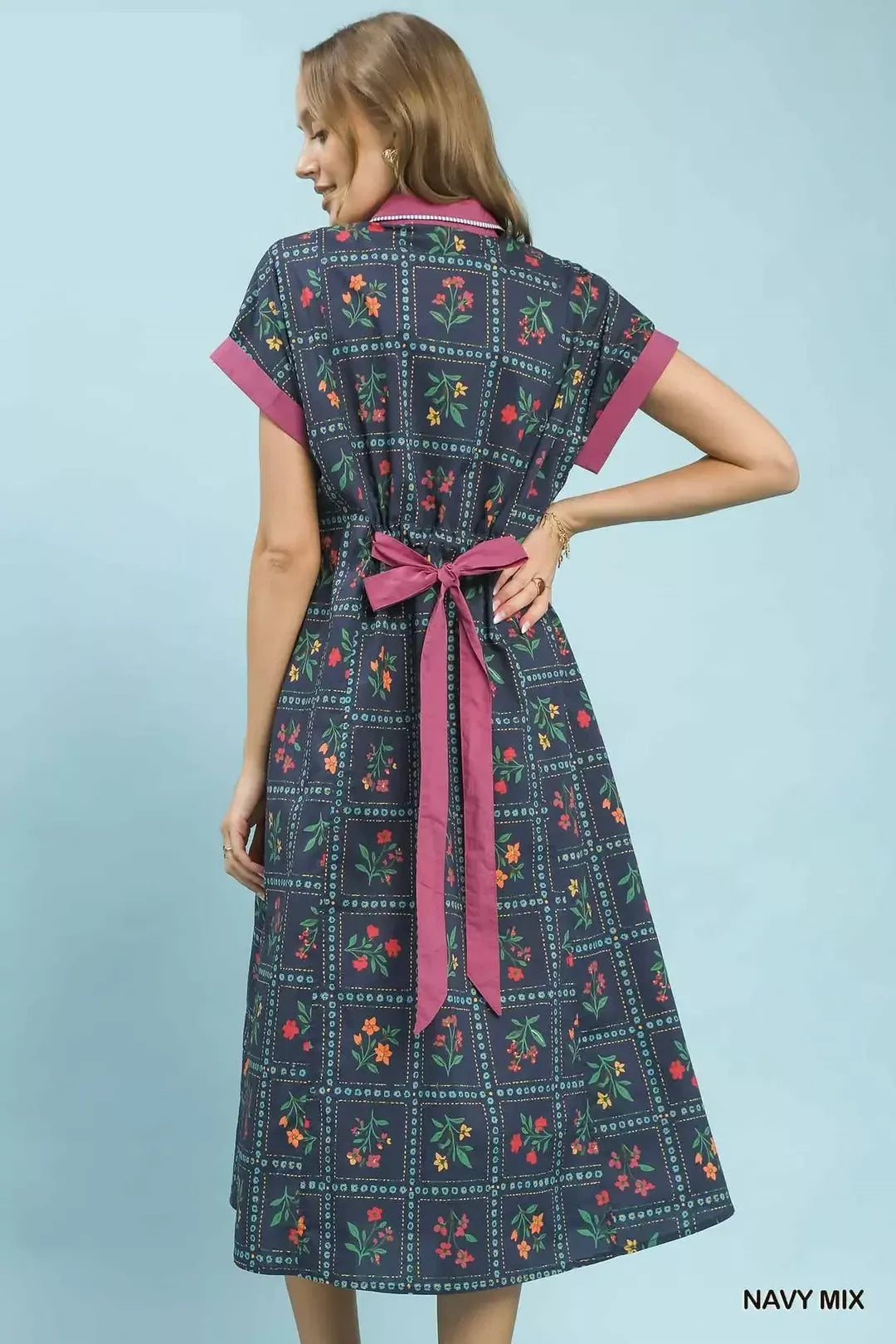navy floral midi dress with button-front detail and belted waist in a romantic boho style