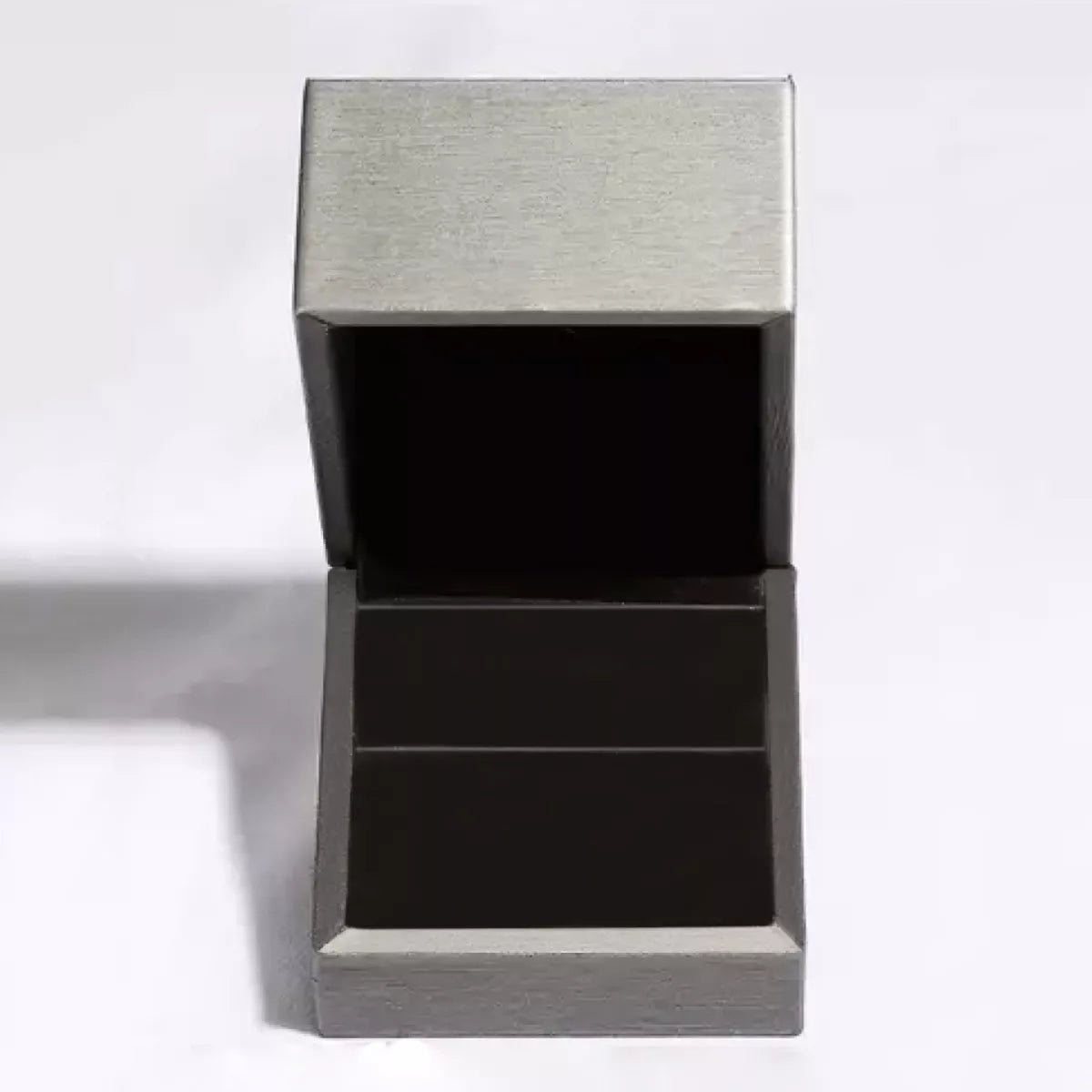 Box for platinum plated sterling silver bunny stud earrings featuring sparkling moissanite stones on a dark background