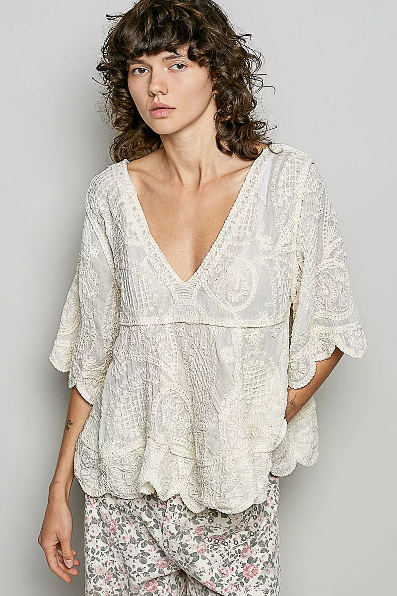 Bohemian crochet V-neck top with scalloped hem and short sleeves in a vintage wash
