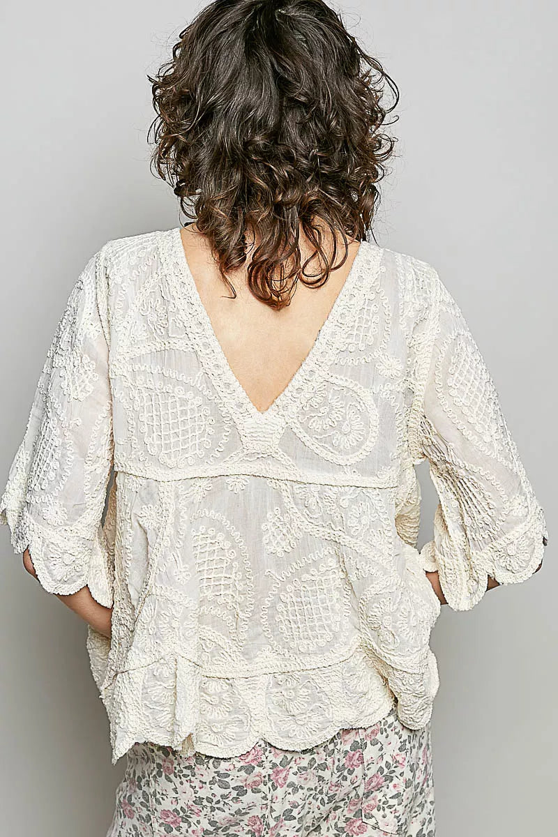 Bohemian crochet V-neck top with scalloped hem and short sleeves in a vintage wash