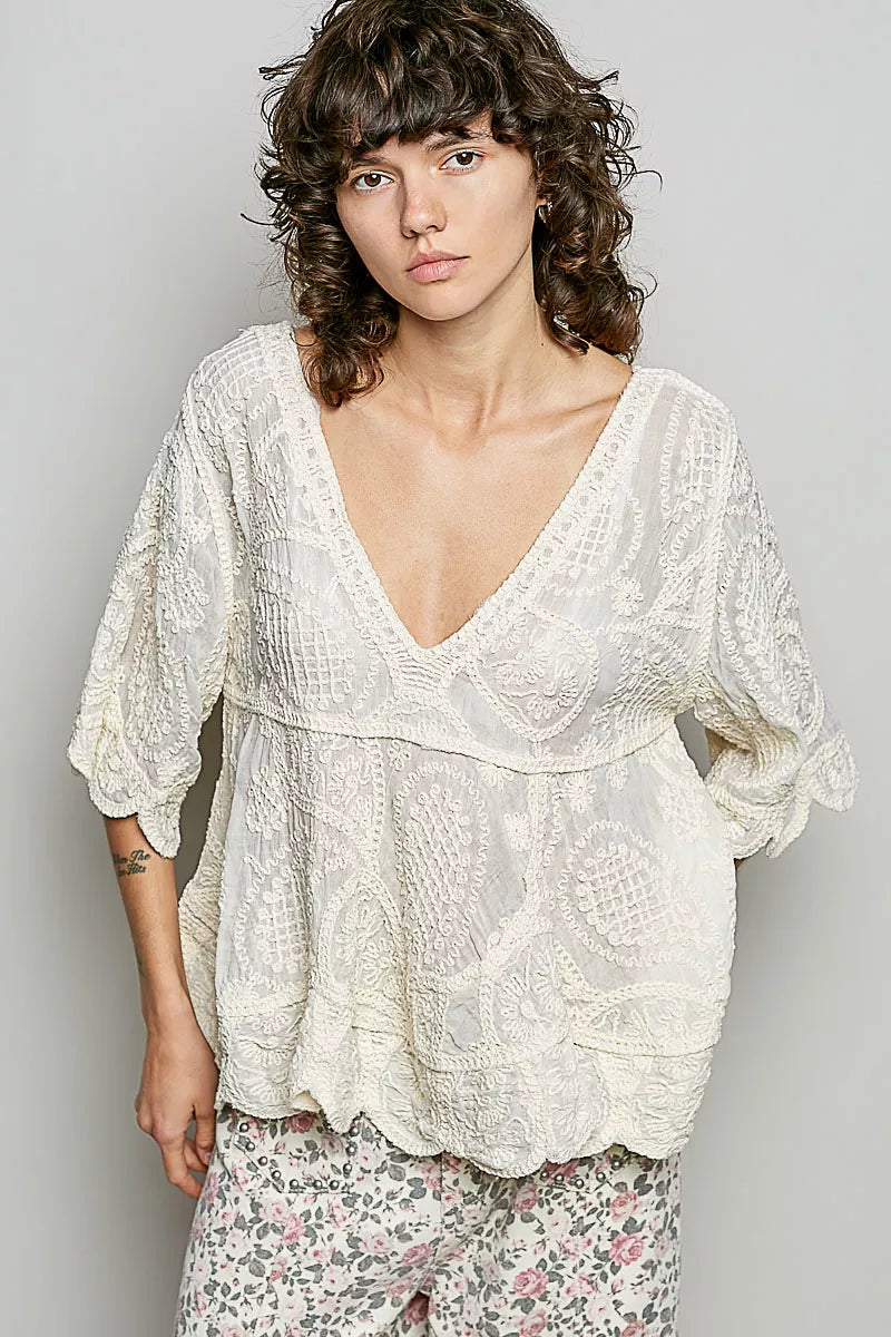 Bohemian crochet V-neck top with scalloped hem and short sleeves in a vintage wash
