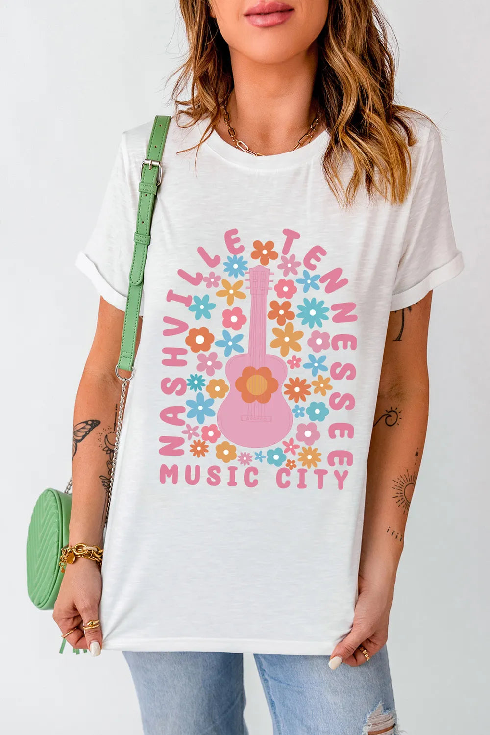 Boutique Nashville Music City graphic tee with pastel floral guitar design