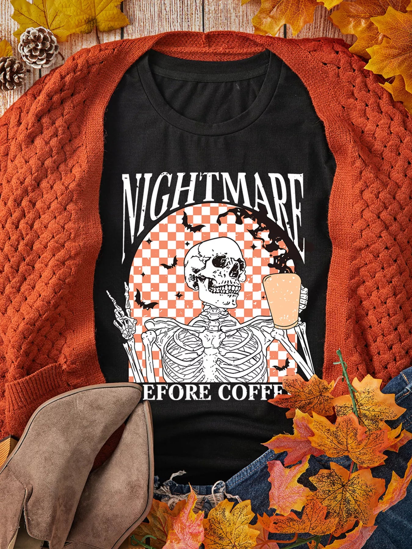 Black Halloween tee with skeleton holding coffee and “Nightmare Before Coffee” text – Nightmare style from A Whimsical Affair.