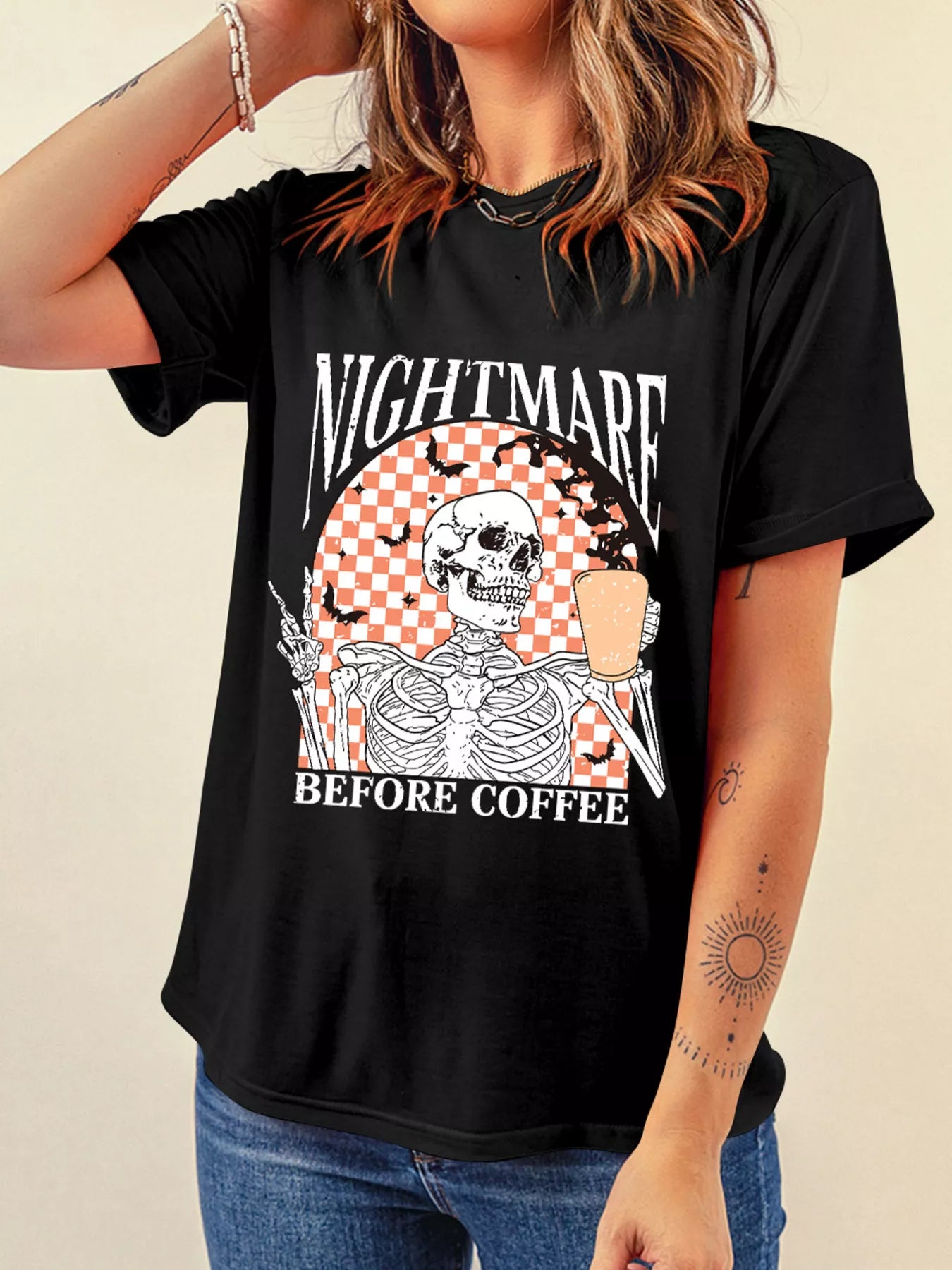 Black Halloween tee with skeleton holding coffee and “Nightmare Before Coffee” text – Nightmare style from A Whimsical Affair.
