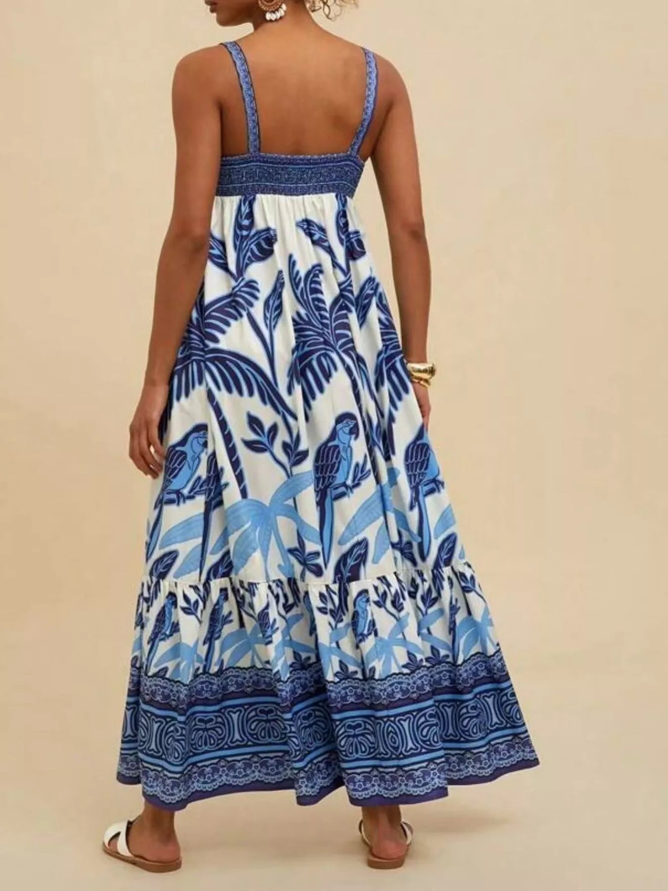 Boho strappy maxi dress with a bold mixed floral-inspired print, flowy skirt, and relaxed summer fit.