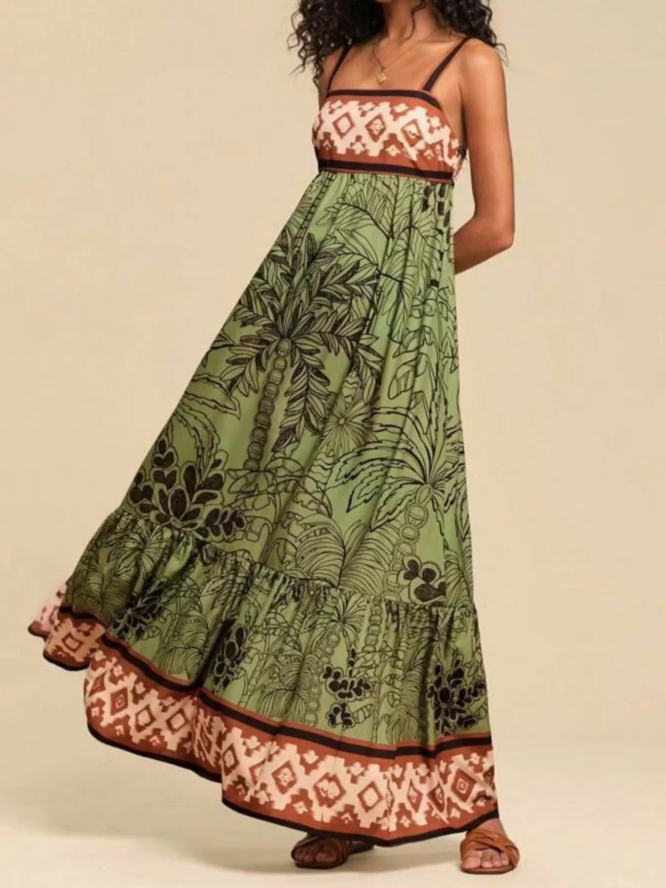Boho strappy maxi dress with a bold mixed floral-inspired print, flowy skirt, and relaxed summer fit.