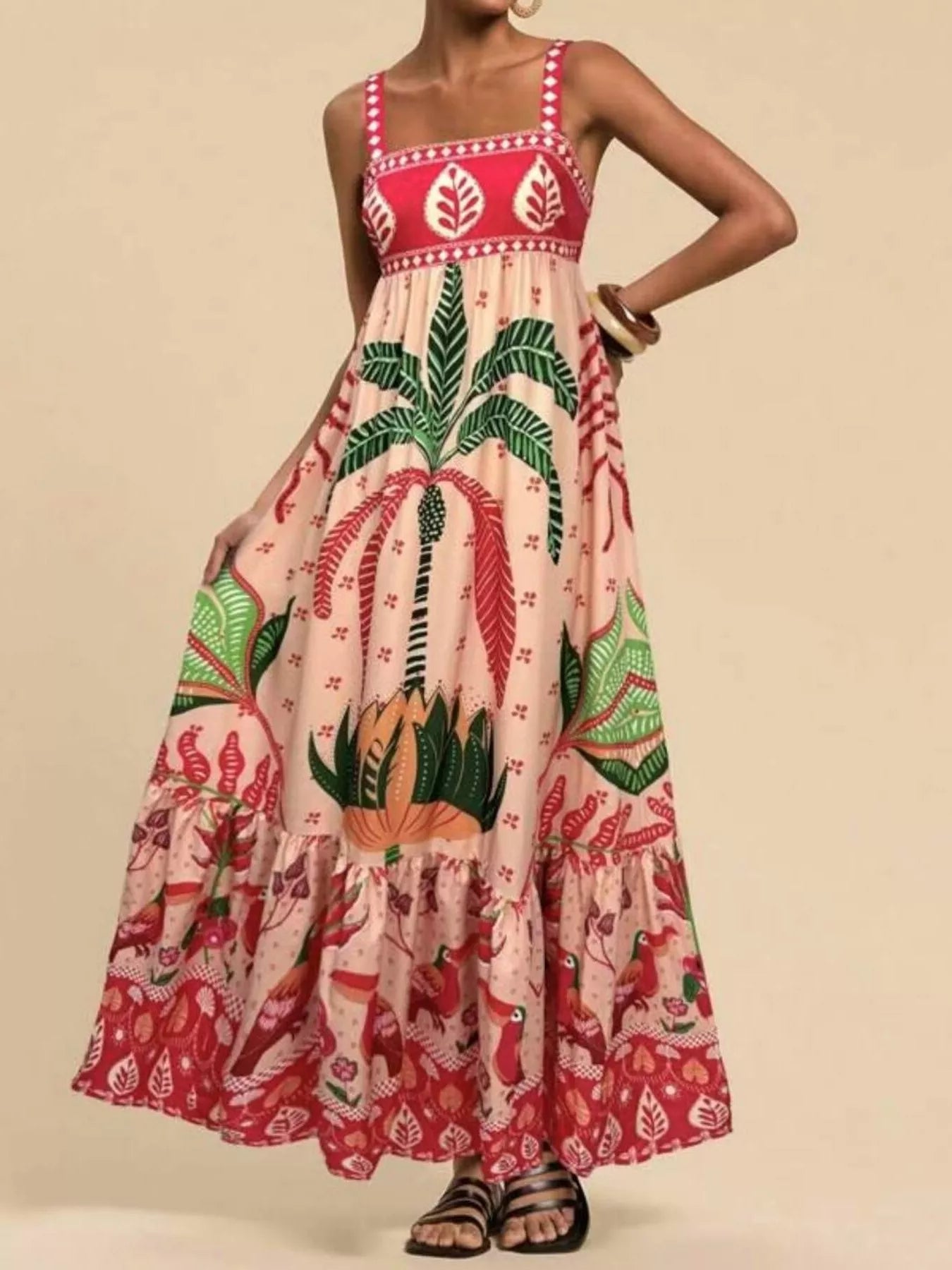 Boho strappy maxi dress with a bold mixed floral-inspired print, flowy skirt, and relaxed summer fit.