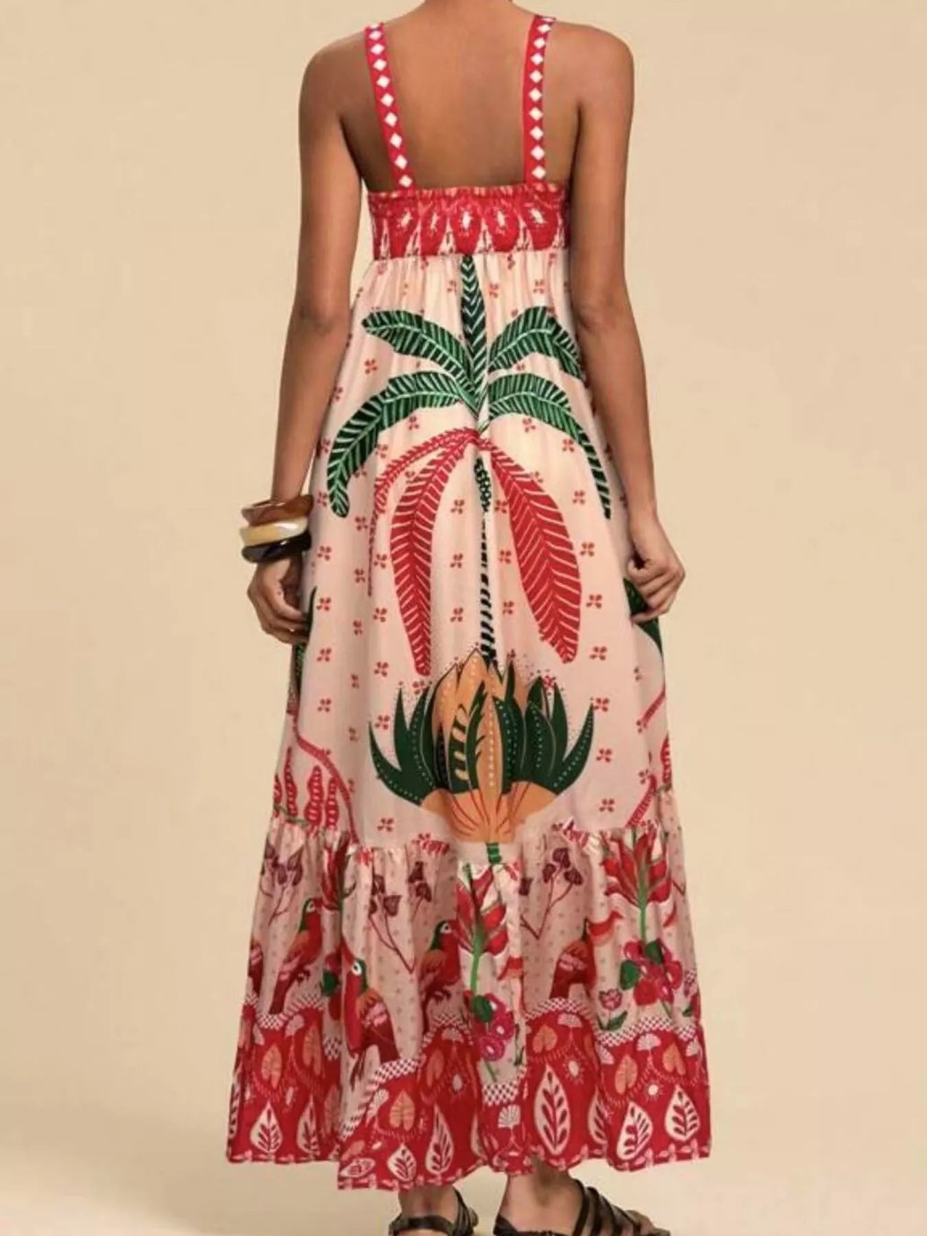 Boho strappy maxi dress with a bold mixed floral-inspired print, flowy skirt, and relaxed summer fit.