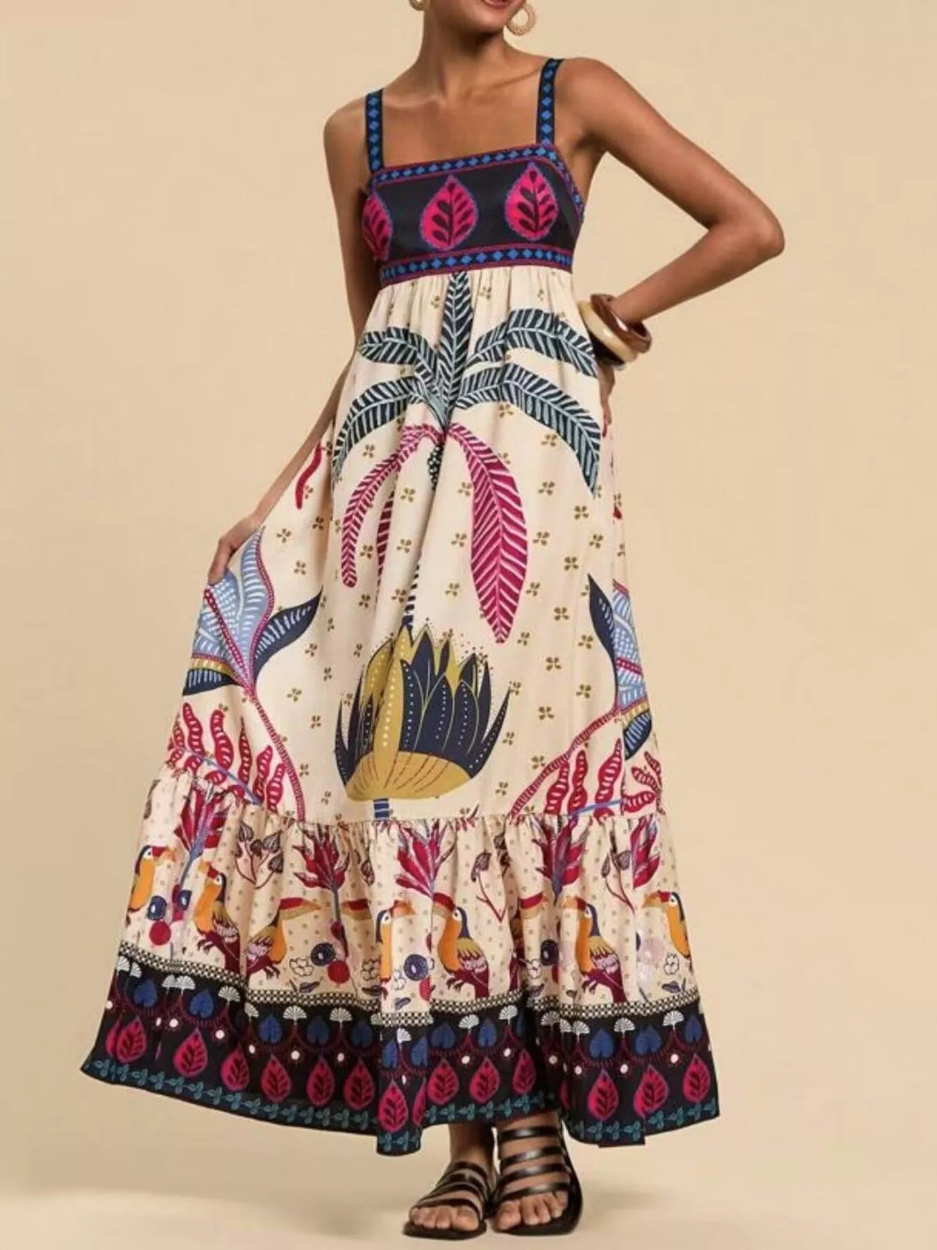 Boho strappy maxi dress with a bold mixed floral-inspired print, flowy skirt, and relaxed summer fit.