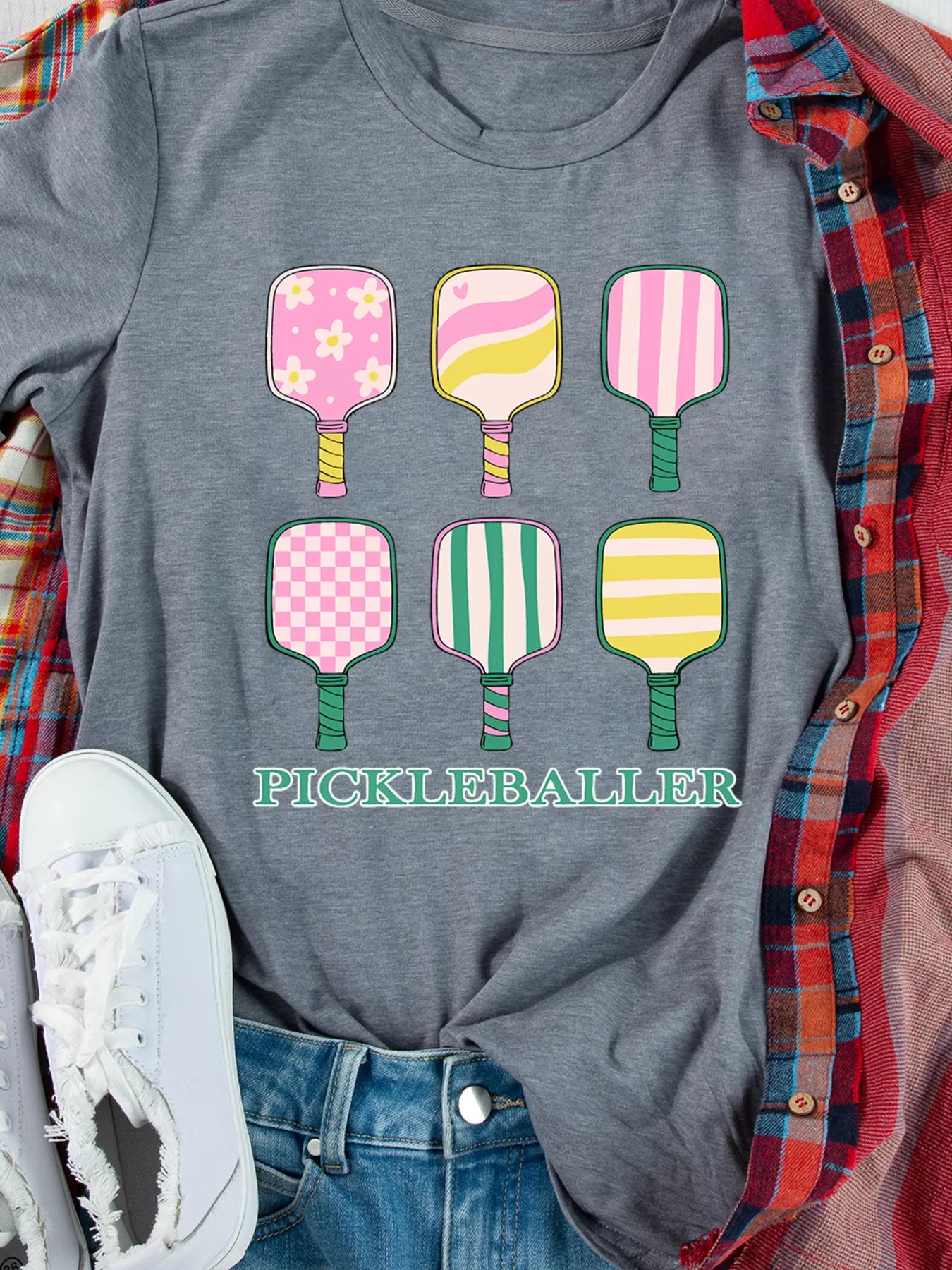 Paddle Party Tee – playful pastel pickleball paddles printed on casual gray t-shirt.