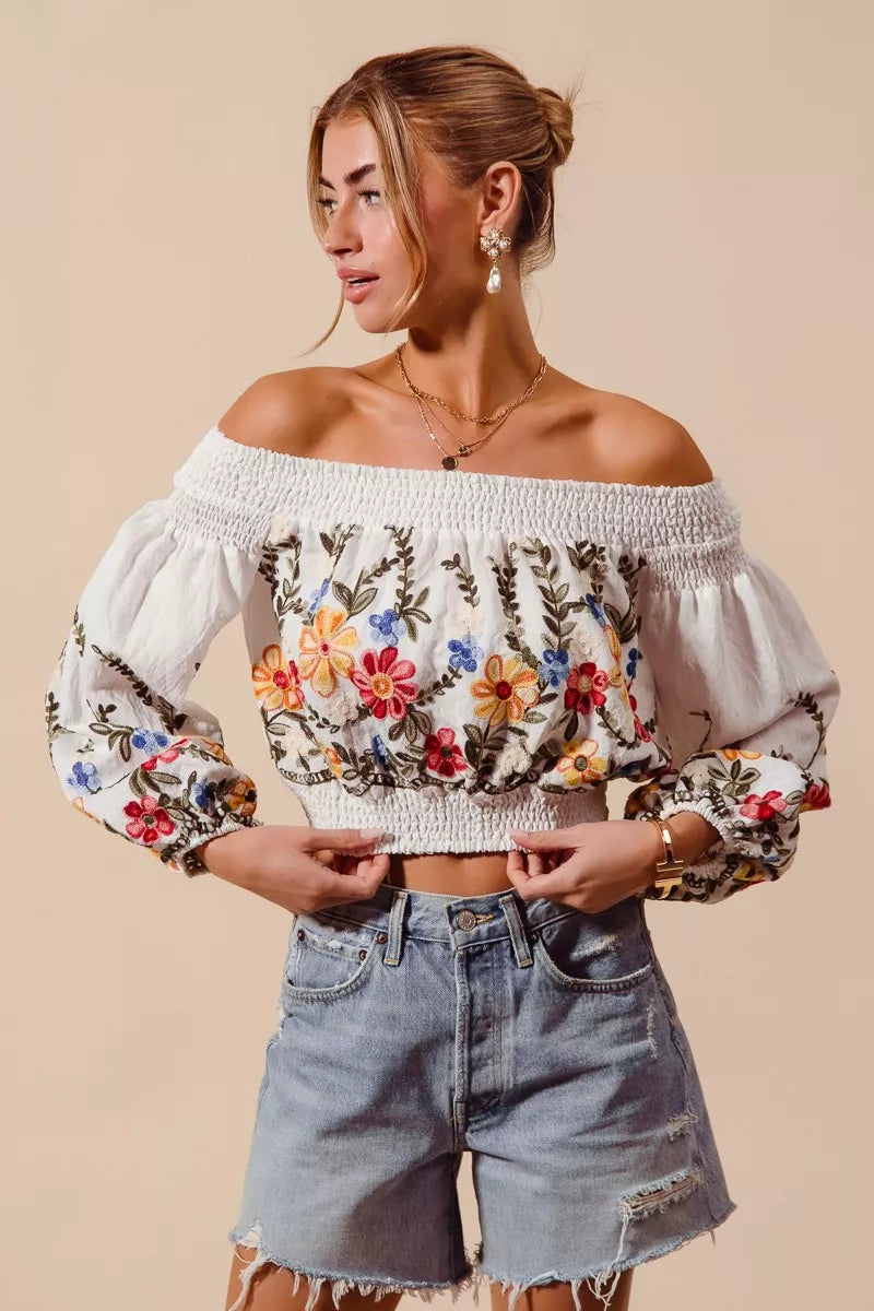 Floral embroidered off-the-shoulder crop top with a relaxed bohemian fit