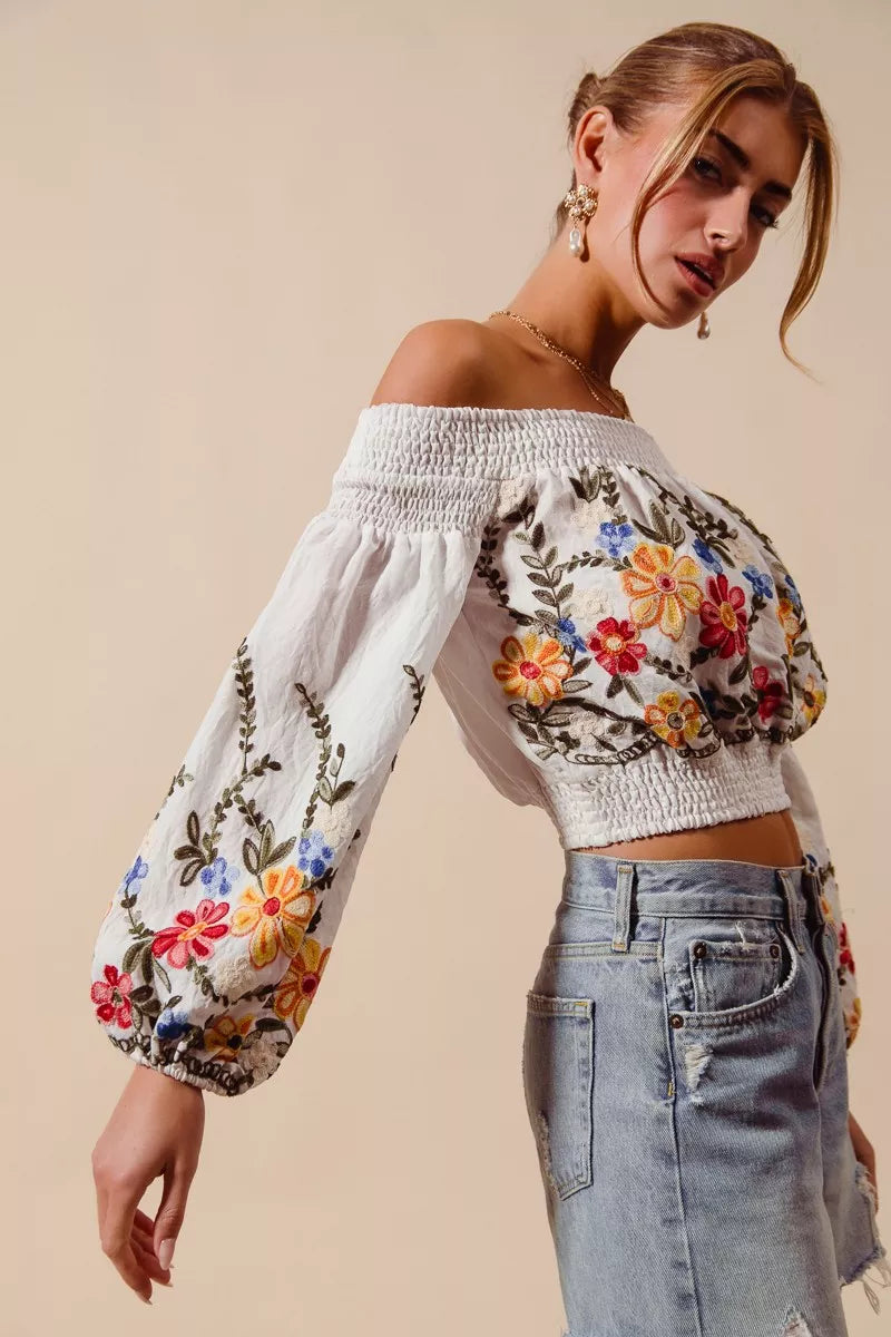 Floral embroidered off-the-shoulder crop top with a relaxed bohemian fit