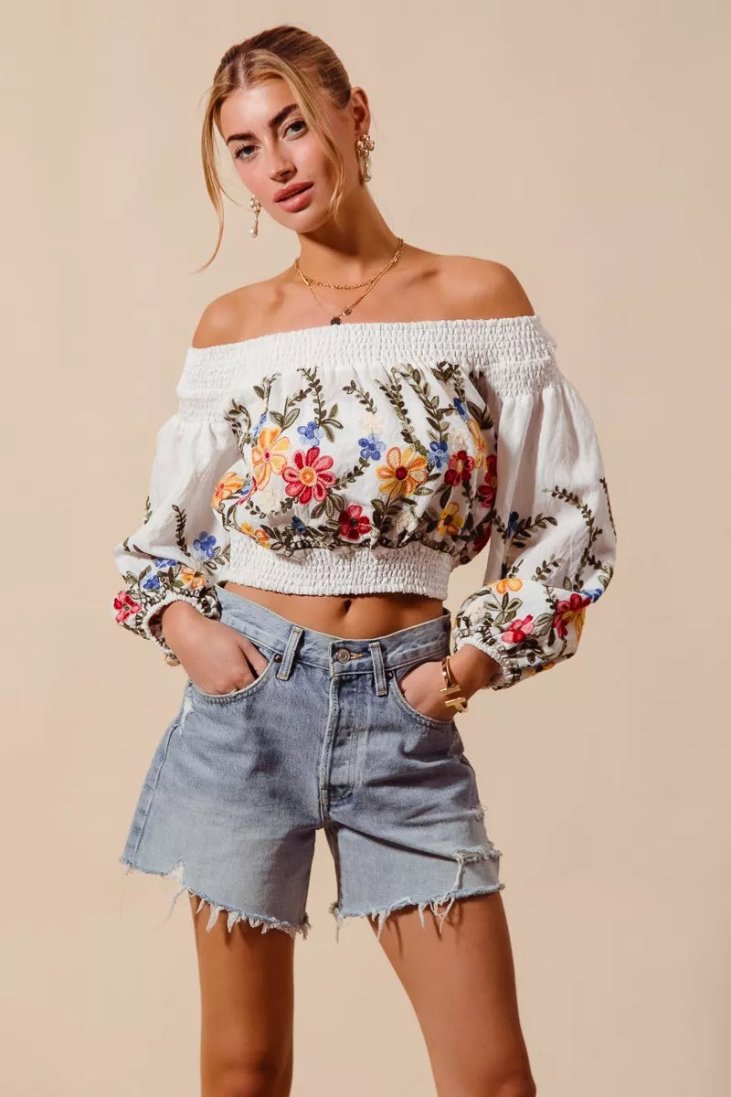 Floral embroidered off-the-shoulder crop top with a relaxed bohemian fit