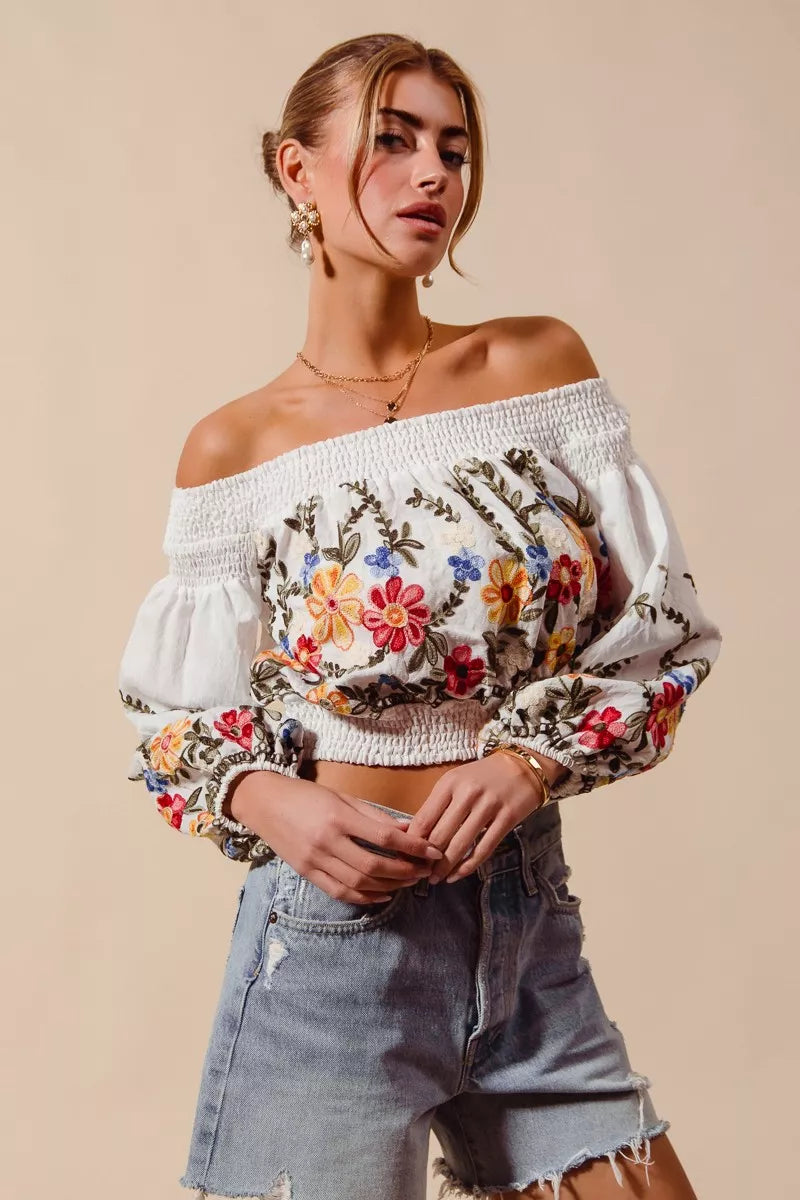Floral embroidered off-the-shoulder crop top with a relaxed bohemian fit