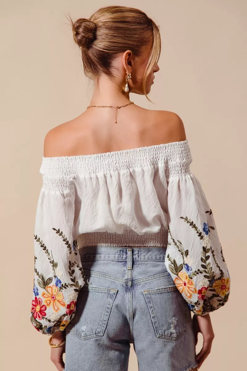 Floral embroidered off-the-shoulder crop top with a relaxed bohemian fit
