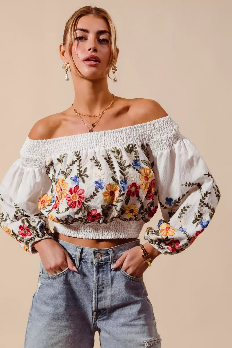 Floral embroidered off-the-shoulder crop top with a relaxed bohemian fit