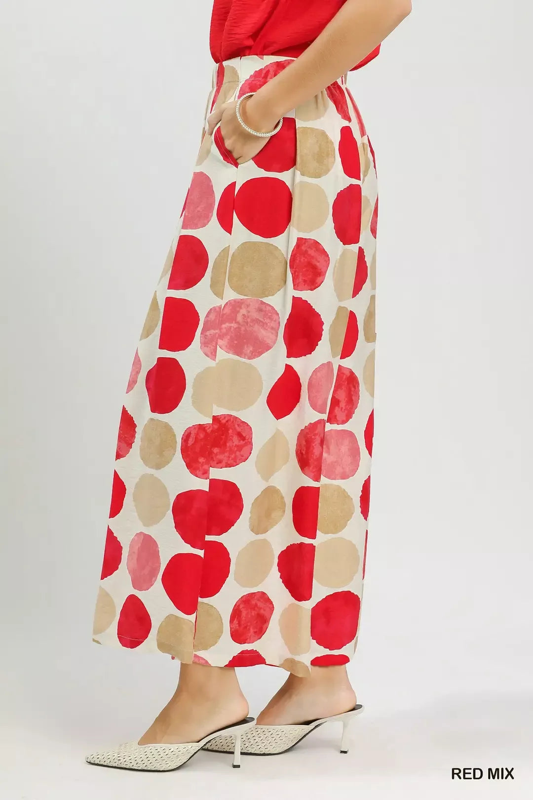 Colorful dot print wide-leg pants with pockets, a relaxed fit, and a flowy lightweight silhouette.