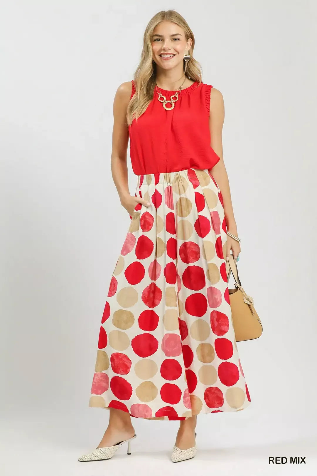 Colorful dot print wide-leg pants with pockets, a relaxed fit, and a flowy lightweight silhouette.