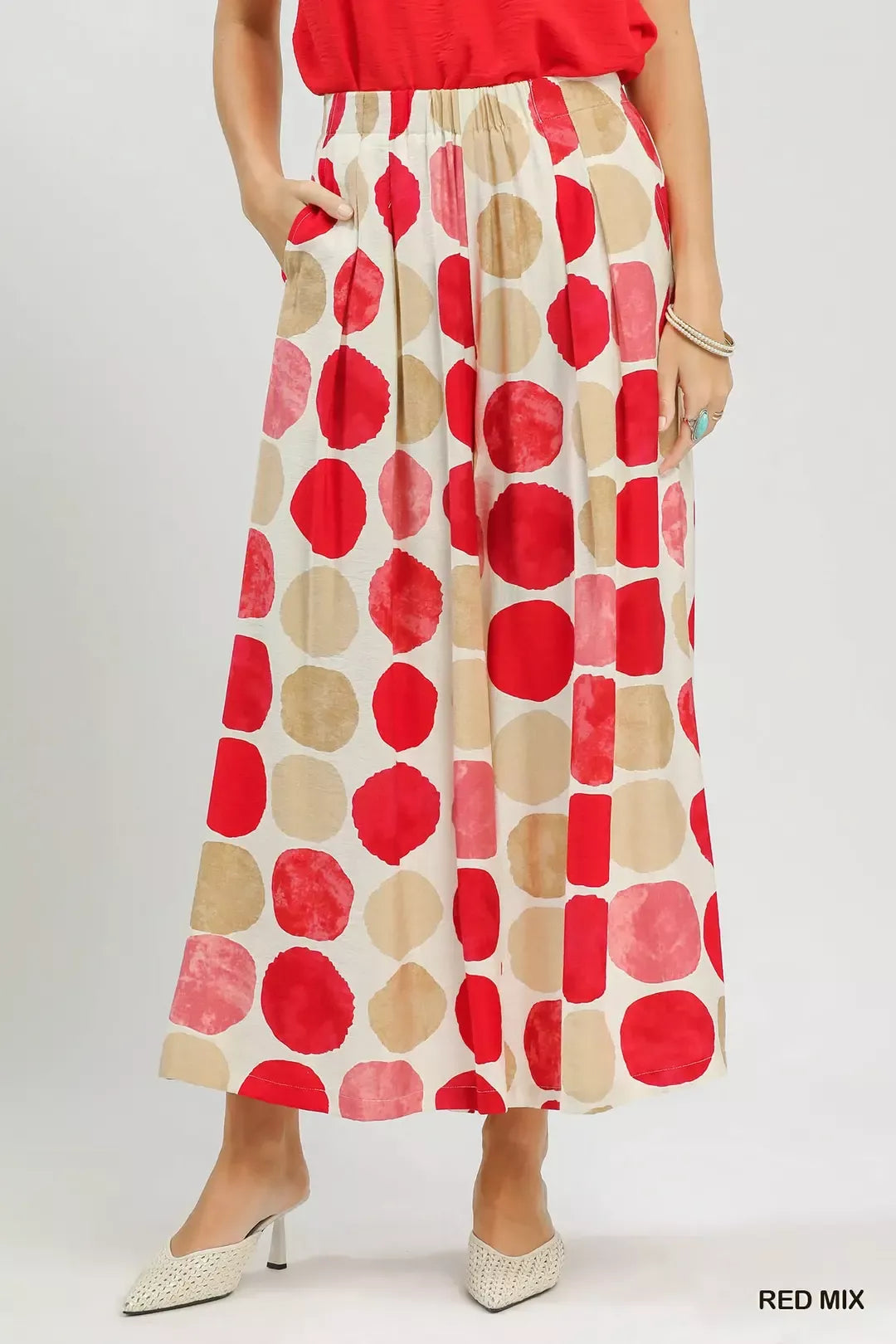 Colorful dot print wide-leg pants with pockets, a relaxed fit, and a flowy lightweight silhouette.