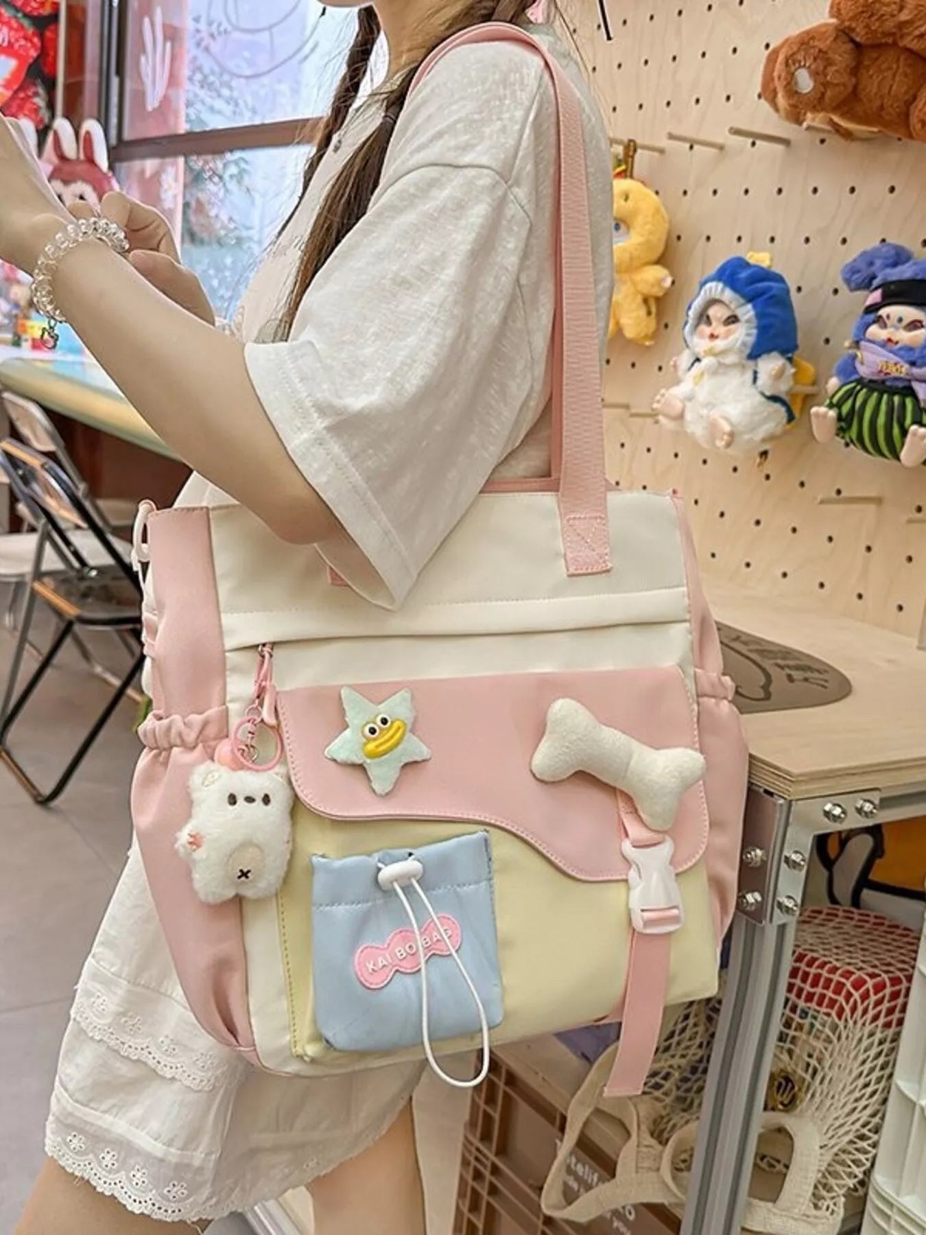 Pastel color-blocked utility tote bag with playful charms and large storage made from Oxford cloth