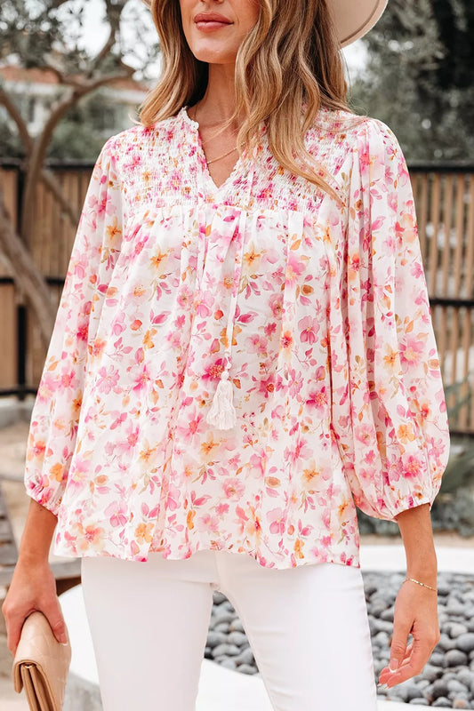 Pink floral smocked blouse with long sleeves and front tie detail
