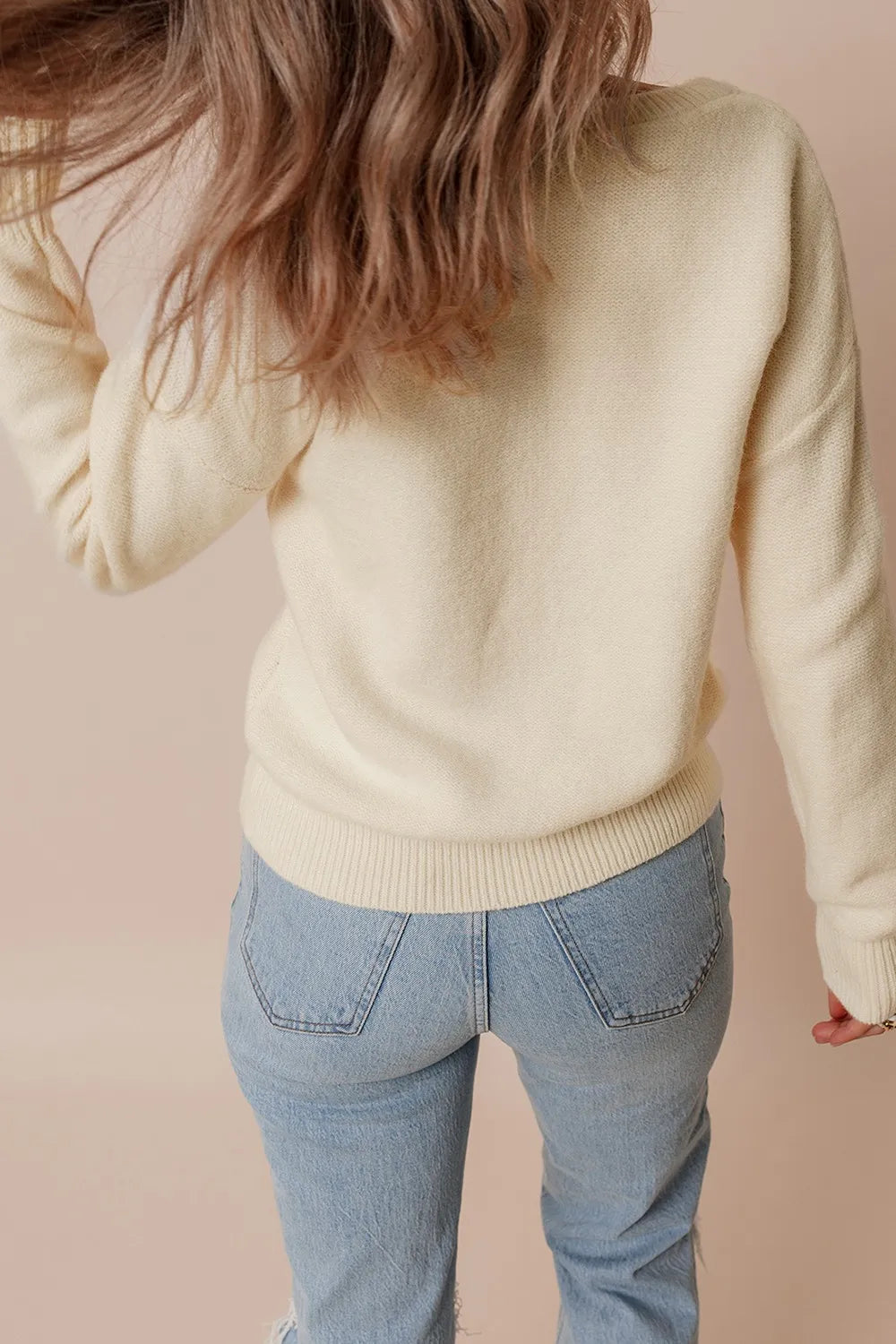Whimsical boutique floral appliqué knit sweater with relaxed fit
