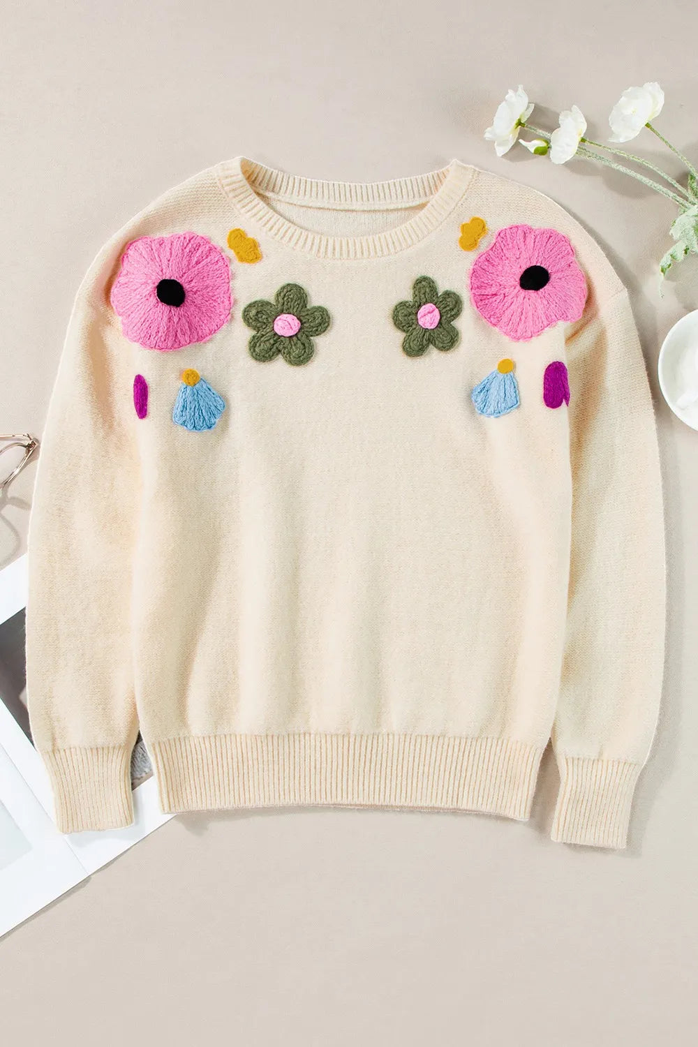 Whimsical boutique floral appliqué knit sweater with relaxed fit