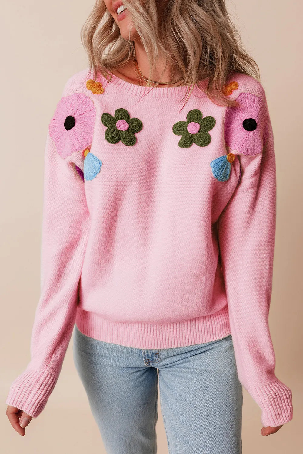 Whimsical boutique floral appliqué knit sweater with relaxed fit