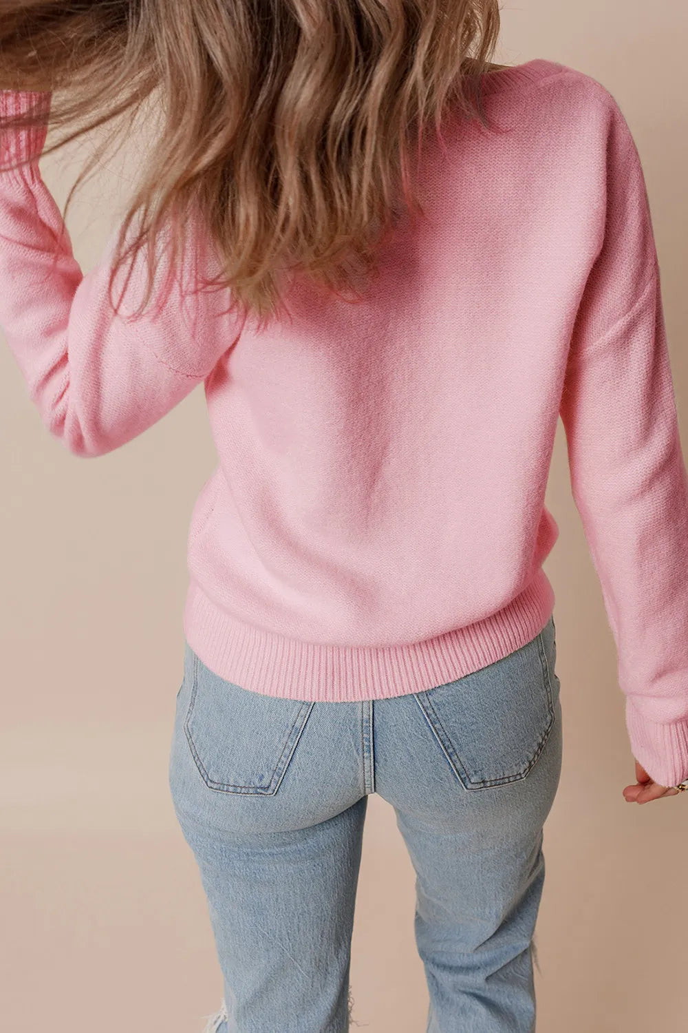 Whimsical boutique floral appliqué knit sweater with relaxed fit