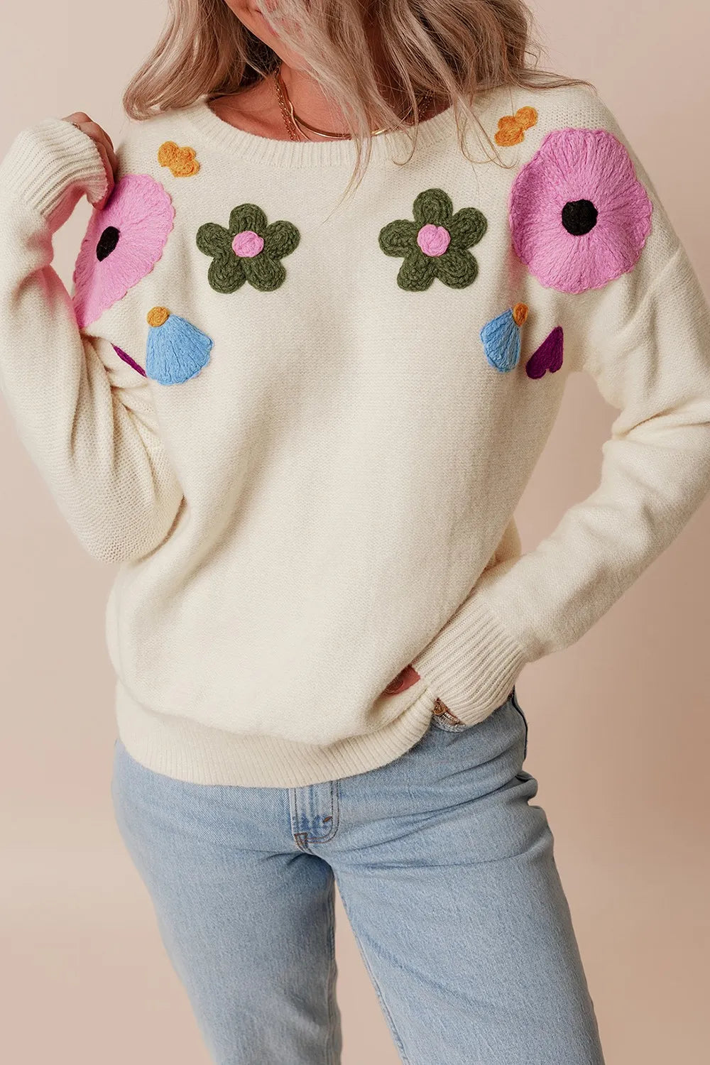 Whimsical boutique floral appliqué knit sweater with relaxed fit