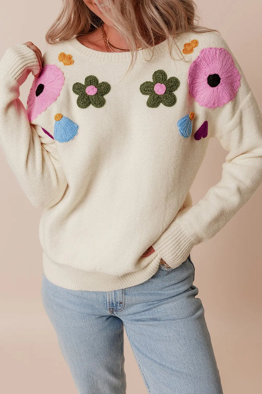 Whimsical boutique floral appliqué knit sweater with relaxed fit