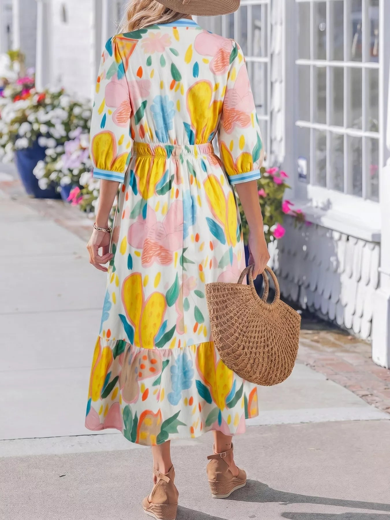 Colorful abstract floral tiered midi dress with flowy silhouette