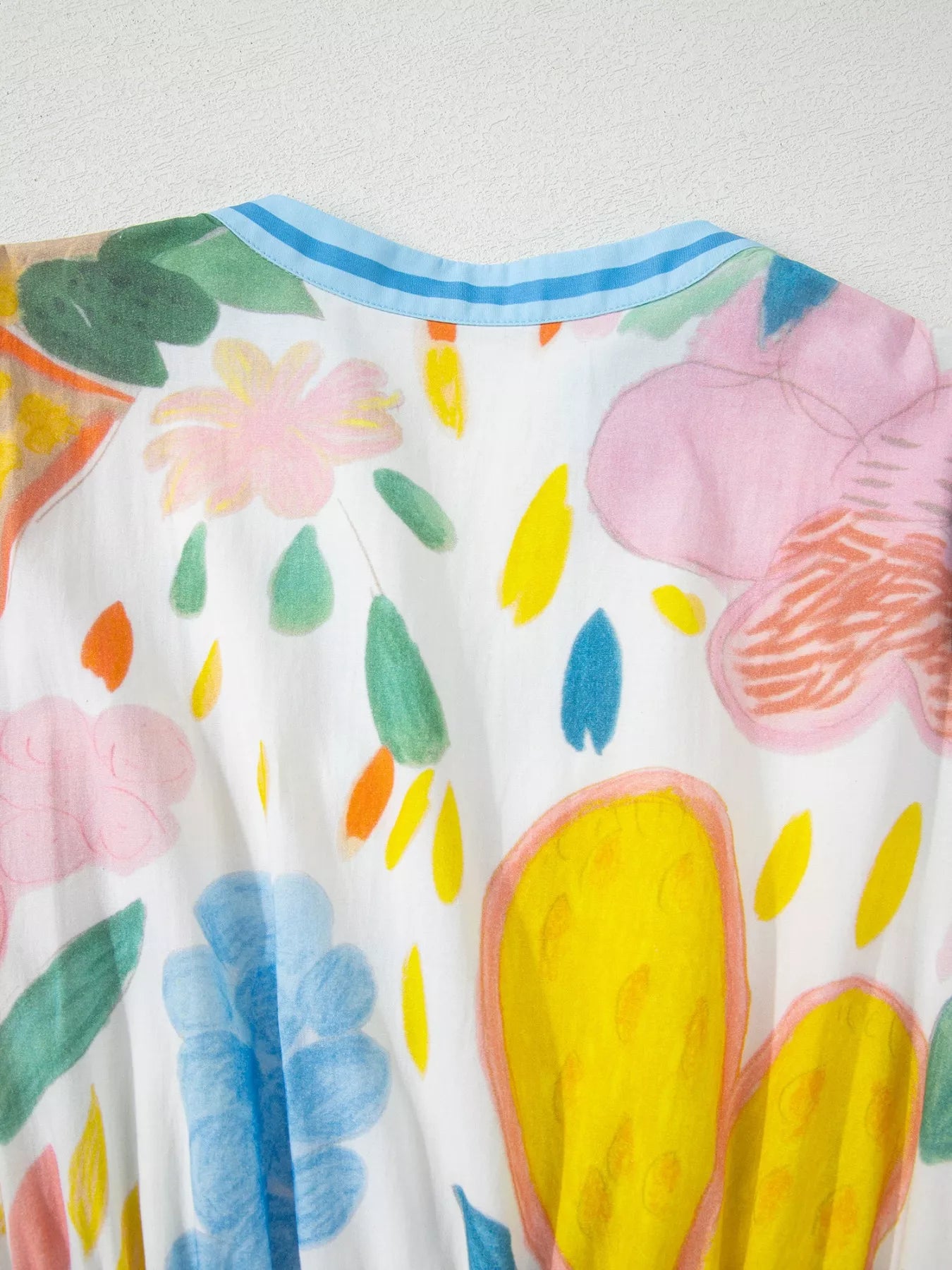 Colorful abstract floral tiered midi dress with flowy silhouette