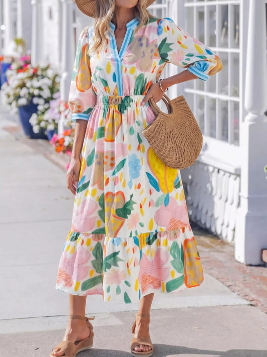 Colorful abstract floral tiered midi dress with flowy silhouette
