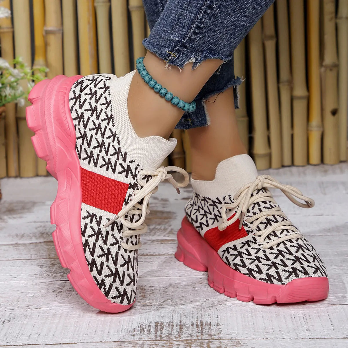 pink knit sneakers with chunky sole, styled with cuffed jeans for a casual whimsical look