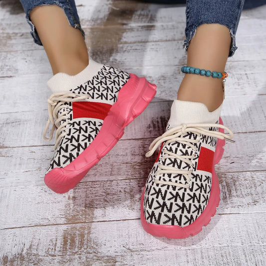 pink knit sneakers with chunky sole, styled with cuffed jeans for a casual whimsical look