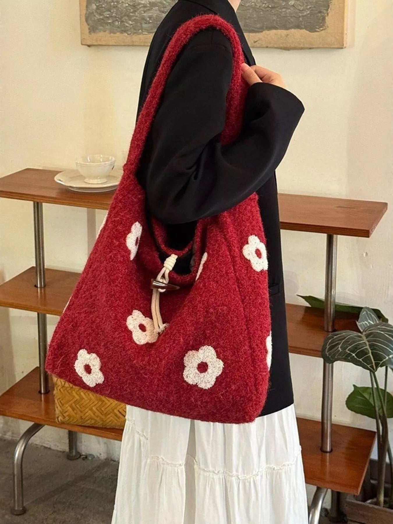 Plush drawstring tote bag with flower details and soft texture, large size.